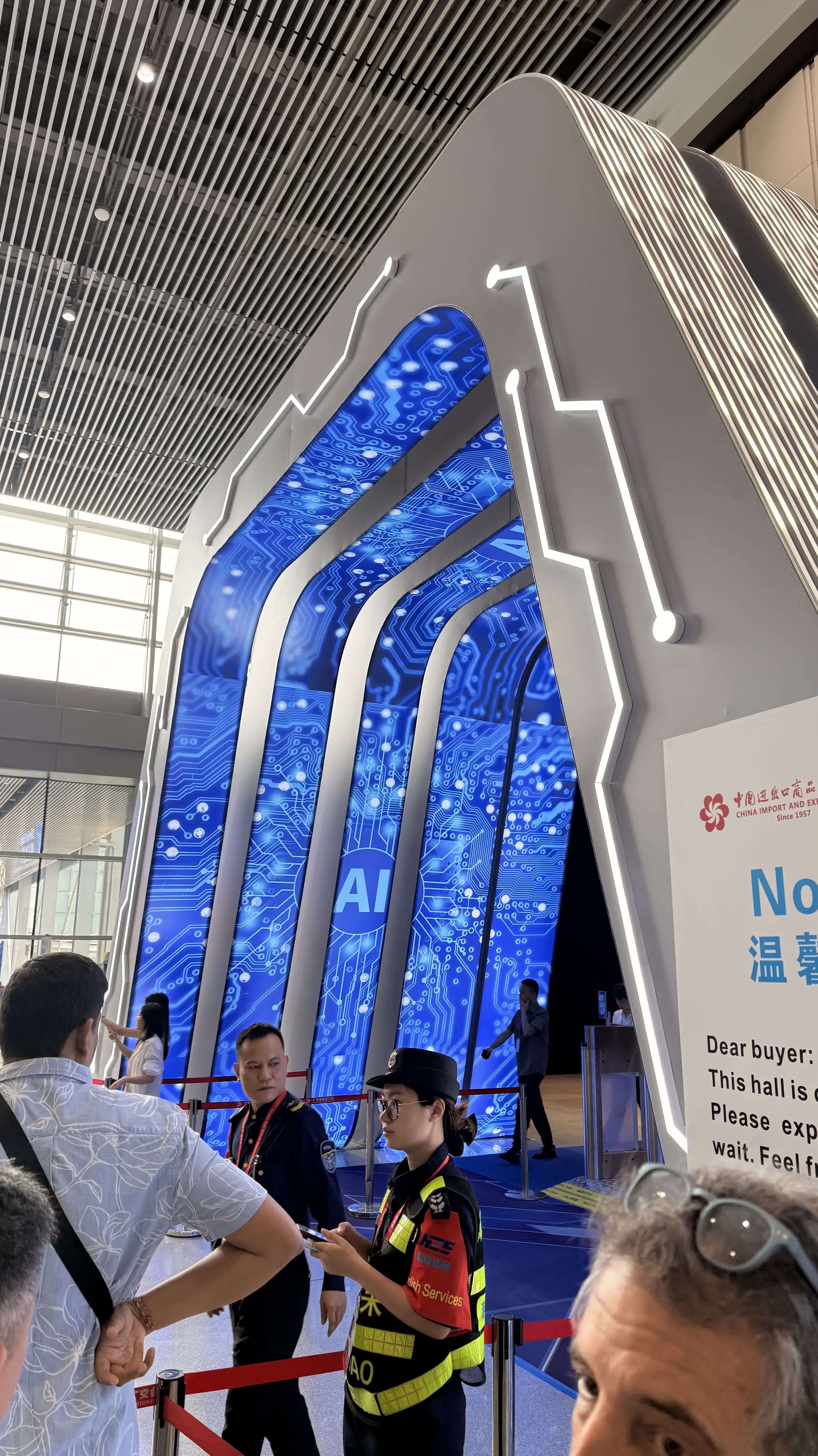The glowing blue circuit-board archway at the entrance to the AI hall
