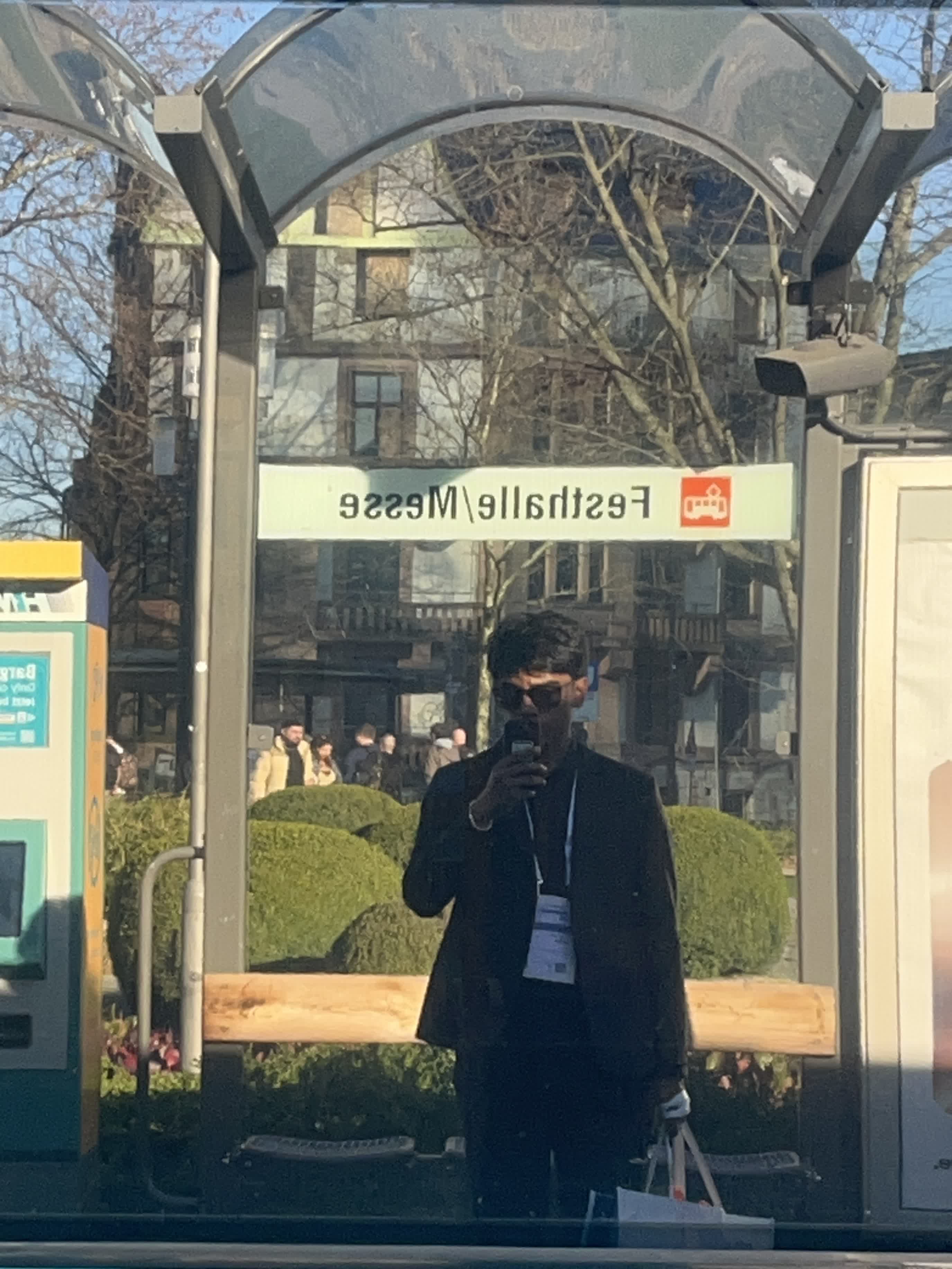 Reflection in the glass of the Festhalle/Messe transit stop
