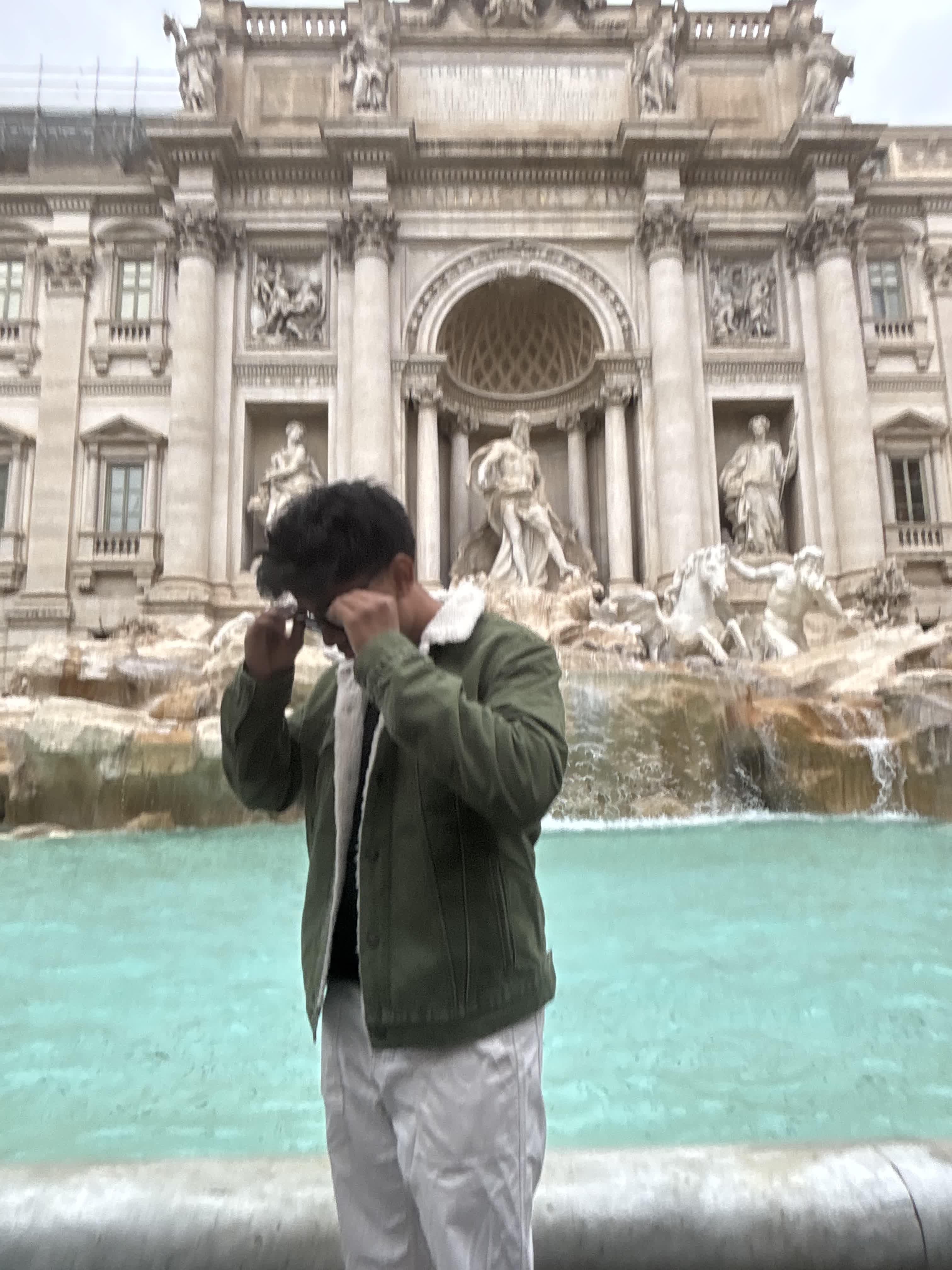Standing in front of the Trevi Fountain in Rome