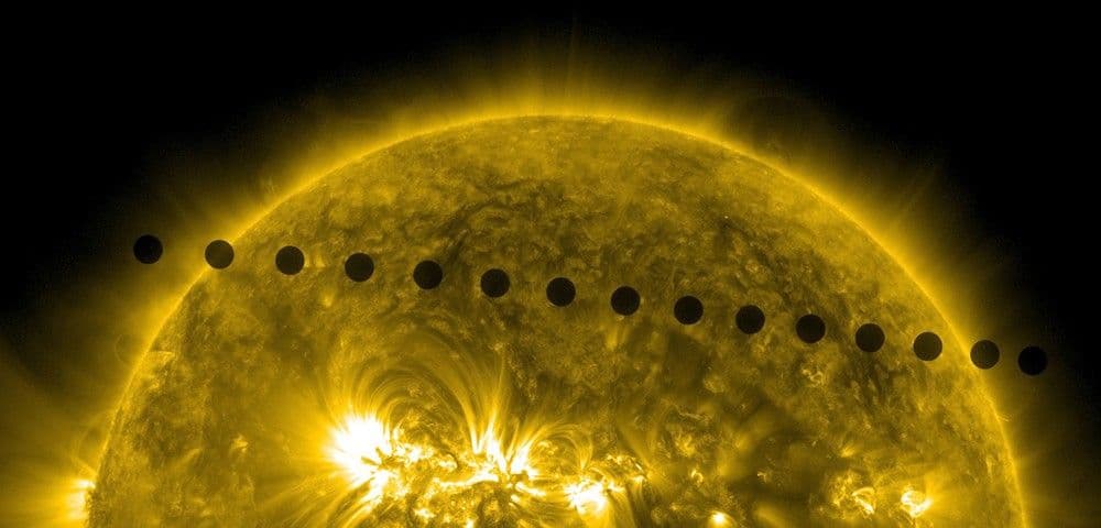 A composite image of Venus as a small black disk crossing the face of the Sun, captured in successive positions during the 2012 transit.